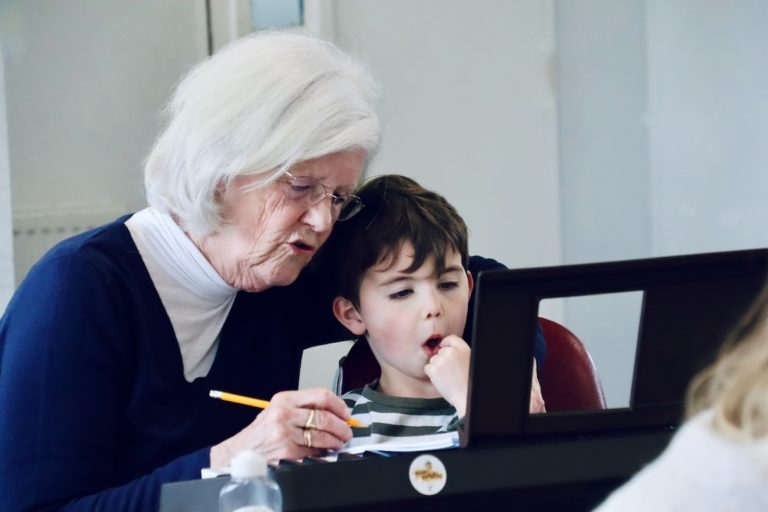 Grandparent with child at the piano